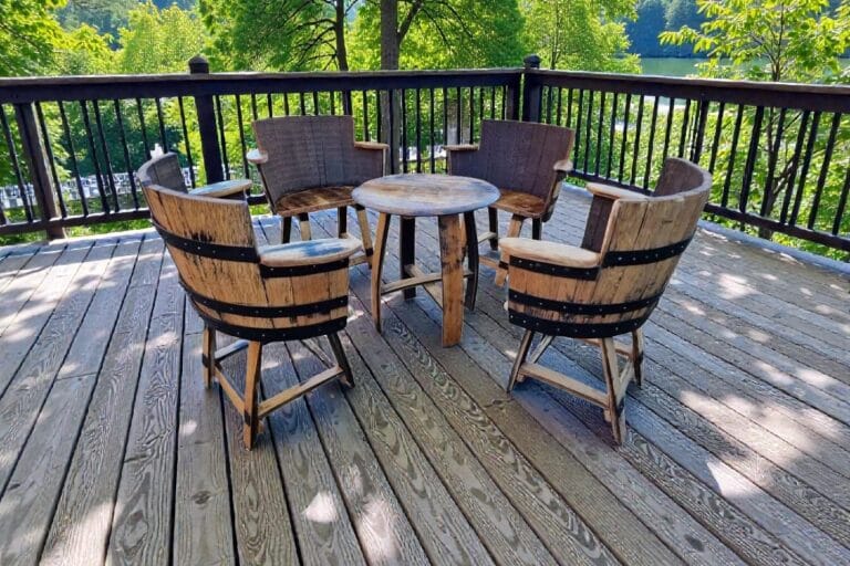 Whisky barrel garden furniture seating set on outdoor decking