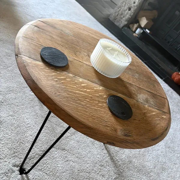 A barrel coffee table in a living room, photographed by Alex