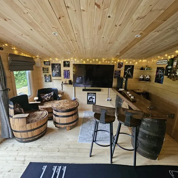 A barrel furniture set in a summer house, photographed by Suzanne